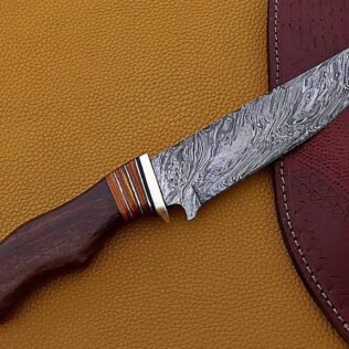 Handmade Damascus hunting knife with leather paouch.
