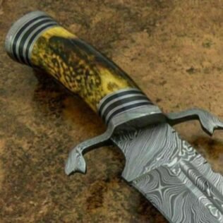 Damascus handmade bowie with leather sheath